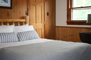 Cozy Adirondack style hotel room with Queen Bed