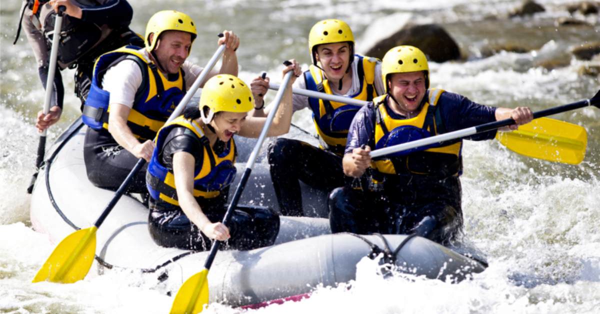 group of people whitewater rafting