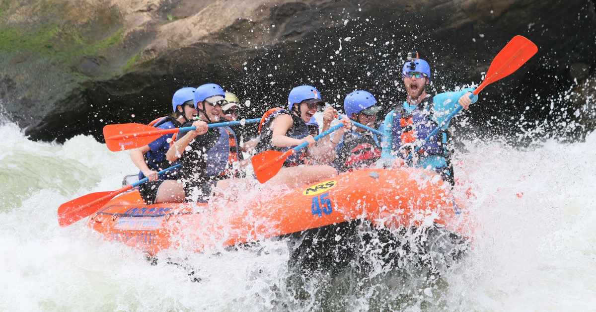group of people whitewater rafting