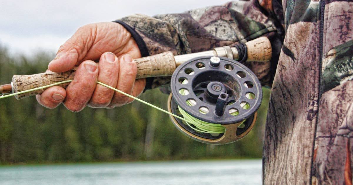 man holding a fishing rod