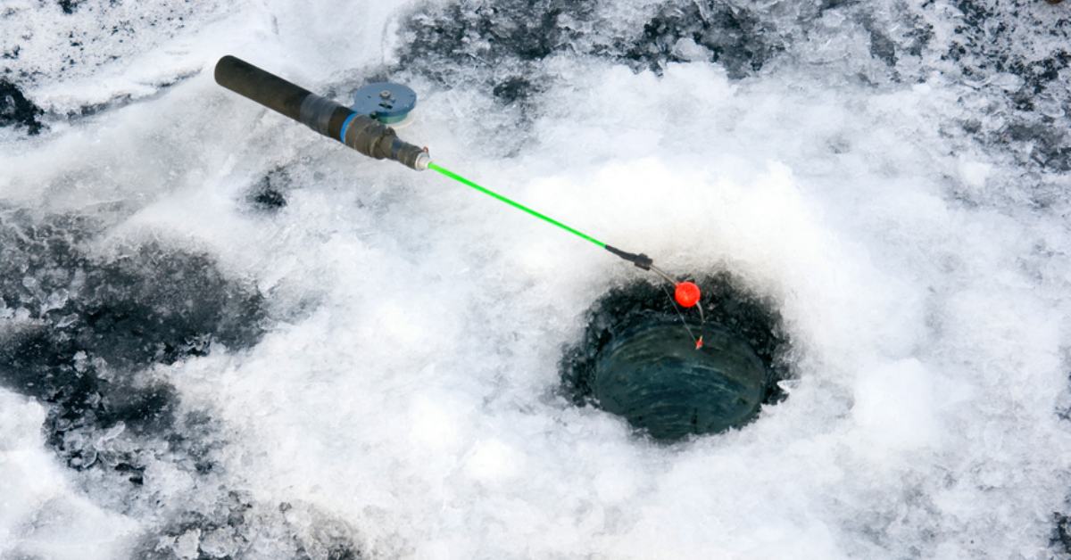 fishing pole above a hole in the ice