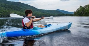 man kayaks