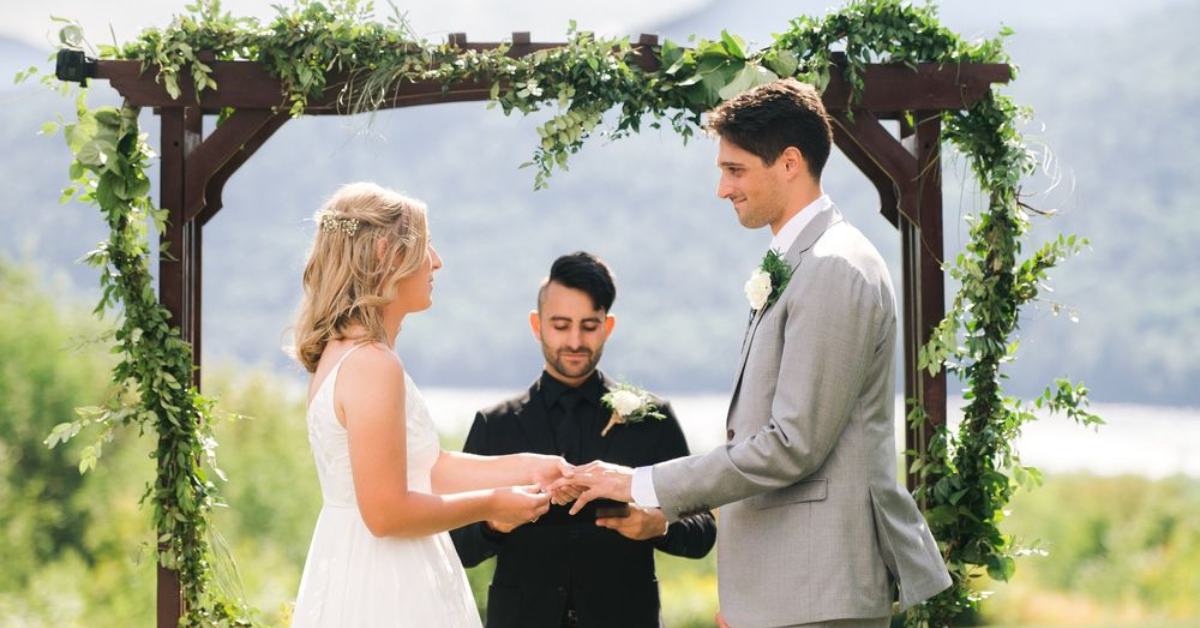wedding couple at the altar holding hands